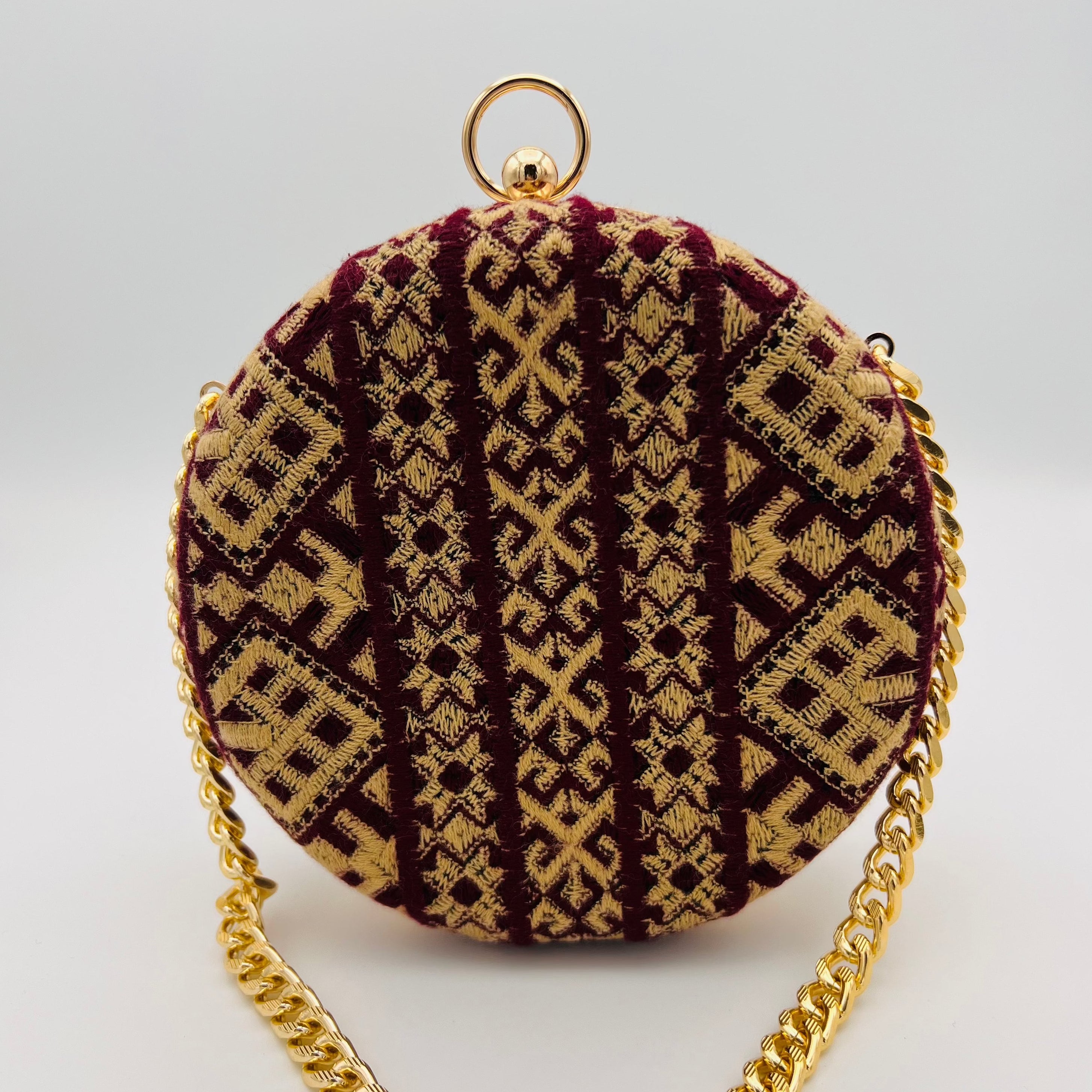 Minaudière sac rond bordeaux sable doré