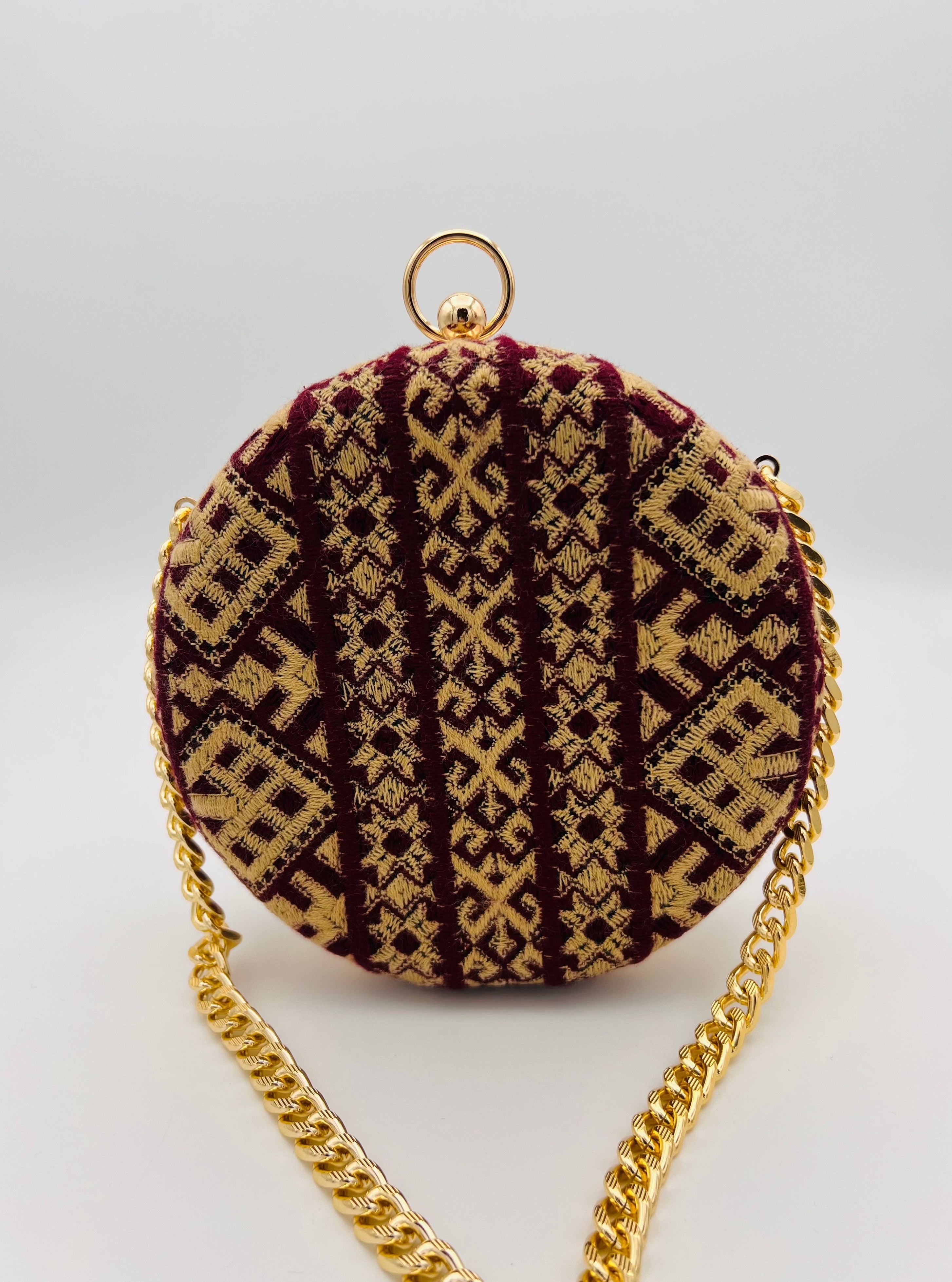 Minaudière sac rond bordeaux sable doré